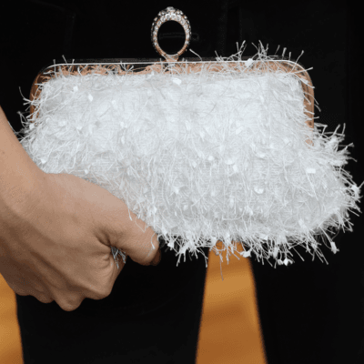 Clutch bag with ring lock with feathers and sequins